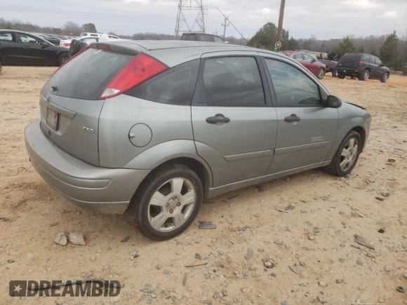 2006 Ford Focus S with VIN 1FAHP37N76W180039, listed as a Copart auction lot 58328565 with 220,696 mi miles and Salvage title. Bid and sale history available at DreamBid. Image 3.