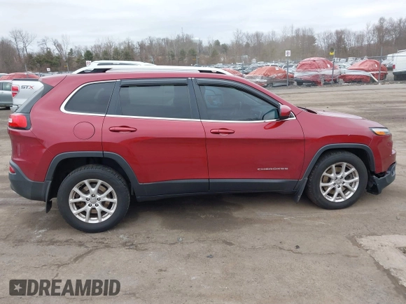 2015 Jeep Cherokee Latitude with VIN 1C4PJMCS6FW594812, listed as a IAAI auction lot 41709068 with 125,232 mi miles. Bid and sale history available at carsss.com. Image 13.