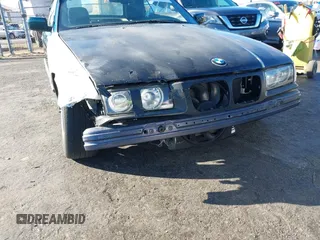 1997 BMW 3-Series 328IC with VIN WBABK8323VET99072, listed as a IAAI auction lot 40669447 with 135,584 mi miles. Bid and sale history available at carsss.com. Image 6.