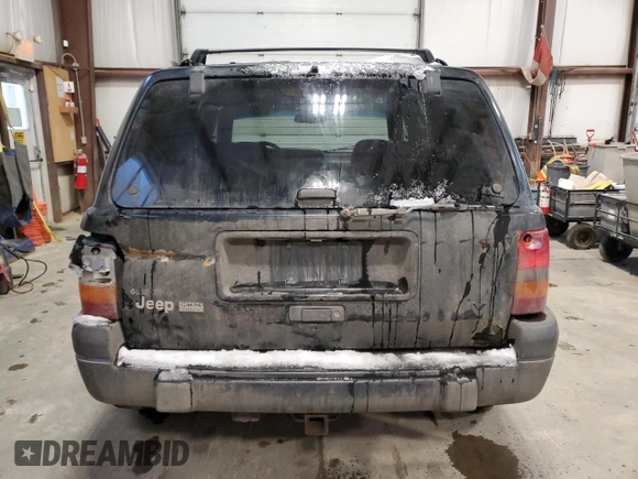 1998 Jeep Grand Cherokee Laredo with VIN 1J4GZ58Y9WC122076, listed as a Copart auction lot 84221784 with 387,353 mi miles and Salvage Title. Bid and sale history available at carsss.com. Image 6.