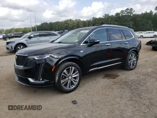 2020 Cadillac XT6 FWD Premium Luxury with VIN 1GYKPCRS6LZ102682, listed as a Copart auction lot 56906645 with 76,884 mi miles and Salvage title. Bid and sale history available at DreamBid. Image 1.