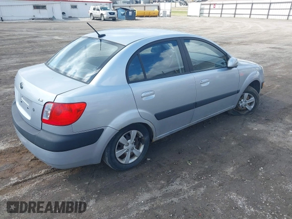 2009 Kia Rio LX with VIN KNADE223796521410, listed as a IAAI auction lot 41887883 with 82,360 mi miles and . Bid and sale history available at DreamBid. Image 4.
