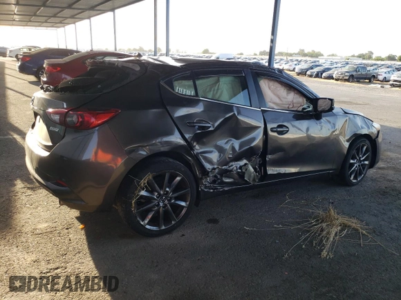 2018 Mazda 3 Touring z VIN 3MZBN1L30JM195471, wystawiony jako Copart lot #57497115 z przebiegiem 147 899 mil mil oraz Szkoda całkowita • Salvage title. Historia ofert i sprzedaży dostępna na DreamBid. Obrazek 3.