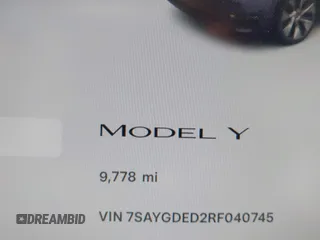 2024 Tesla Model Y with VIN 7SAYGDED2RF040745, listed as a IAAI auction lot 41986613 with 9,778 mi miles and . Bid and sale history available at DreamBid. Image 15.