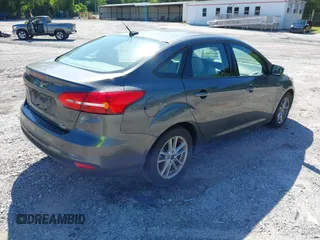 2018 Ford Focus SE z VIN 1FADP3FE1JL238012, wystawiony jako IAAI lot #42185232 z przebiegiem 143 687 mil mil oraz . Historia ofert i sprzedaży dostępna na DreamBid. Obrazek 4.