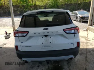 2020 Ford Escape Titanium с VIN 1FMCU9J93LUB38014, выставлен на аукционе Copart как лот 52348725 с пробегом 78 193 миль миль и Списание • Salvage title. История ставок и продаж доступна на DreamBid. Изображение 6.