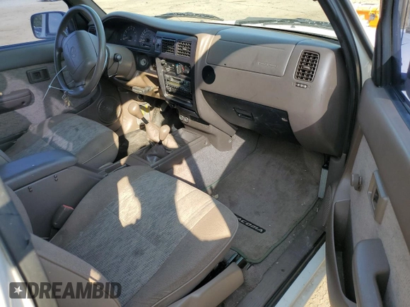 1999 Toyota Tacoma with VIN 4TAPM62N8XZ457624, listed as a Copart auction lot 71565904 with 133,851 mi miles and Salvage Title. Bid and sale history available at DreamBid. Image 10.
