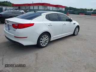 2015 Kia Optima EX with VIN 5XXGN4A77FG452747, listed as a IAAI auction lot 42772766 with 97,243 mi miles and . Bid and sale history available at DreamBid. Image 4.