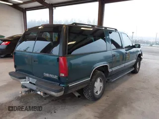 1997 Chevrolet Suburban with VIN 3GNFK16R6VG118242, listed as a IAAI auction lot 41349416 with 183,439 mi miles. Bid and sale history available at carsss.com. Image 4.