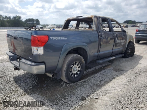 2010 Toyota Tundra с VIN 5TFUM5F15AX005061, выставлен на аукционе Copart как лот 51823565 с пробегом Не указан миль и Списание • Salvage title. История ставок и продаж доступна на DreamBid. Изображение 3.