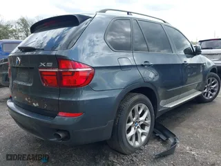 2011 BMW X5 35i with VIN 5UXZV4C56BL406632, listed as a IAAI auction lot 41981590 with 168,534 mi miles. Bid and sale history available at carsss.com. Image 4.
