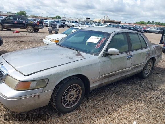 2002 Mercury Grand Marquis GS z VIN 2MEFM74W92X607734, wystawiony jako IAAI lot #42413400 z przebiegiem 209 565 mil mil oraz . Historia ofert i sprzedaży dostępna na DreamBid. Obrazek 2.