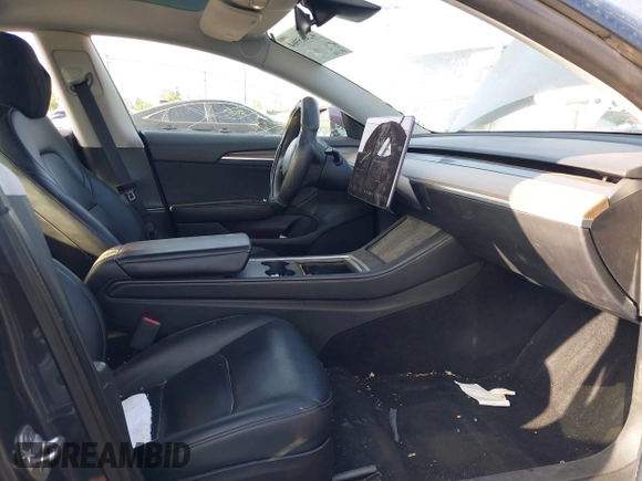 2023 Tesla Model 3 with VIN 5YJ3E1EA4PF427022, listed as a IAAI auction lot 42465964 with 169,346 mi miles and . Bid and sale history available at DreamBid. Image 5.