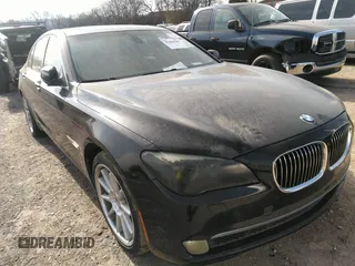 2011 BMW 7 Series 740i with VIN WBAKA4C55BC612634, listed as a IAAI auction lot 35404385 with 156,003 mi miles. Bid and sale history available at carsss.com. Image 1.