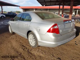 2011 Ford Fusion Hybrid with VIN 3FADP0L35BR256789, listed as a IAAI auction lot 40737584 with 133,683 mi miles. Bid and sale history available at carsss.com. Image 3.
