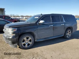 2015 Chevrolet Suburban LT with VIN 1GNSKJKC2FR274506, listed as a Copart auction lot 87881695 with 196,506 mi miles and Salvage Title. Bid and sale history available at DreamBid. Image 1.