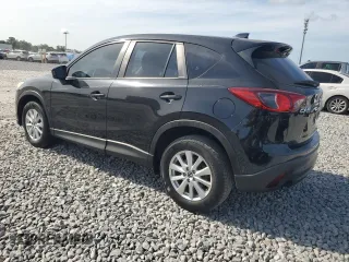 2014 Mazda CX-5 Sport with VIN JM3KE2BE3E0361736, listed as a Copart auction lot 64306405 with 114,468 mi miles and Clean title. Bid and sale history available at DreamBid. Image 2.