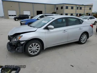2019 Nissan Sentra S z VIN 3N1AB7AP8KY281270, wystawiony jako Copart lot #50032885 z przebiegiem 107 570 mil mil oraz Czysty tytuł • Clean title. Historia ofert i sprzedaży dostępna na DreamBid. Obrazek 1.