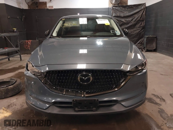 2021 Mazda CX-5 Touring with VIN JM3KFBCM5M0394707, listed as a IAAI auction lot 41887973 with 44,670 mi miles. Bid and sale history available at carsss.com. Image 13.