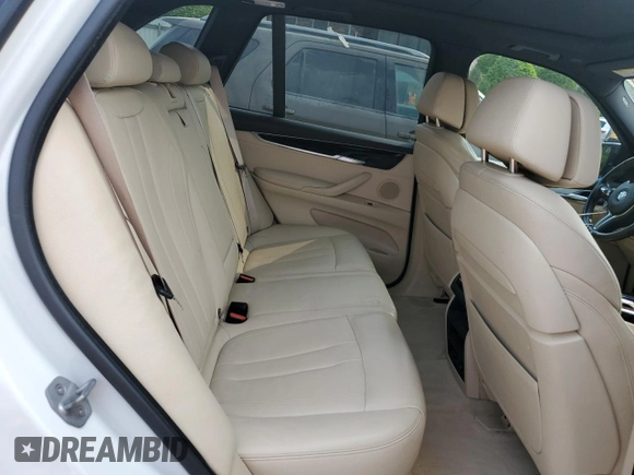 2015 BMW X5 xDrive50i z VIN 5UXKR6C5XF0J77462, wystawiony jako Copart lot #58912895 z przebiegiem 100 086 mil mil oraz Czysty tytuł • Clean title. Historia ofert i sprzedaży dostępna na DreamBid. Obrazek 11.
