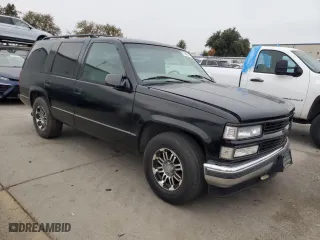 1997 Chevrolet Tahoe with VIN 1GNEC13R3VJ406120, listed as a Copart auction lot 81569674 with 203,863 mi miles and Salvage Title. Bid and sale history available at carsss.com. Image 4.