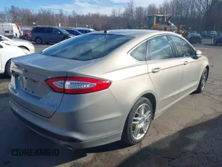2015 Ford Fusion SE Hybrid with VIN 3FA6P0LUXFR133979, listed as a IAAI auction lot 41831288 with 143,738 mi miles. Bid and sale history available at carsss.com. Image 4.