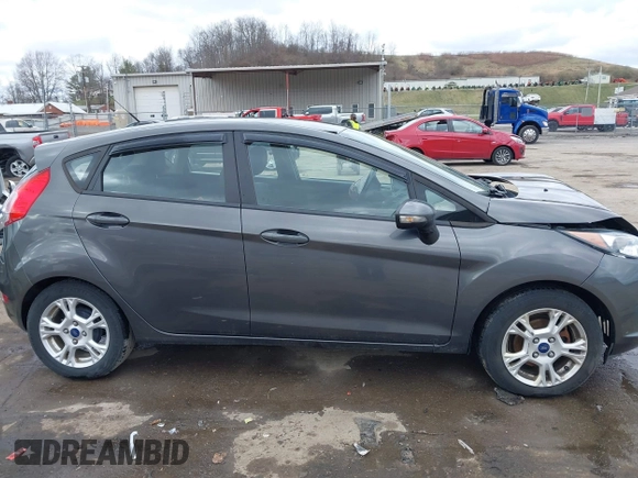 2015 Ford Fiesta SE with VIN 3FADP4EJ0FM117739, listed as a IAAI auction lot 41795558 with 111,000 mi miles. Bid and sale history available at carsss.com. Image 13.