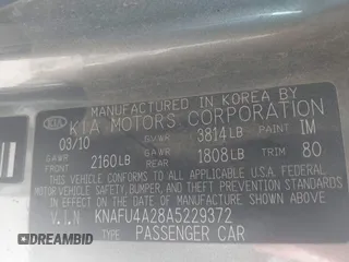 2010 Kia Forte EX with VIN KNAFU4A28A5229372, listed as a IAAI auction lot 41911118 with 166,084 mi miles. Bid and sale history available at carsss.com. Image 9.