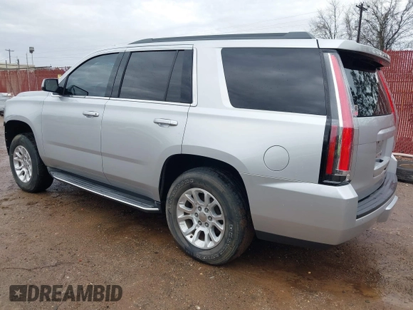 2015 GMC Yukon SLT with VIN 1GKS1BKC7FR628736, listed as a IAAI auction lot 41709926 with 130,254 mi miles. Bid and sale history available at carsss.com. Image 3.