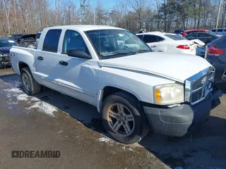 2007 Dodge Dakota SLT z VIN 1D7HW48JX7S166780, wystawiony jako IAAI lot #41375942 z przebiegiem 148 778 mil mil oraz . Historia ofert i sprzedaży dostępna na DreamBid. Obrazek 1.