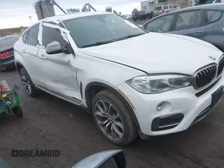 2015 BMW X6 xDrive35i with VIN 5UXKU2C57F0N77194, listed as a IAAI auction lot 41818860 with 105,579 mi miles and . Bid and sale history available at DreamBid. Image 1.