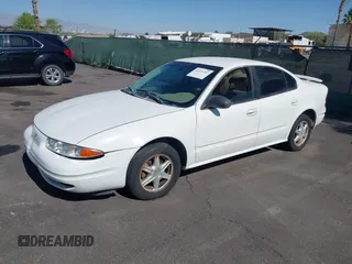2003 Oldsmobile Alero GL1 z VIN 1G3NL52F53C323443, wystawiony jako IAAI lot #42271207 z przebiegiem 138 180 mil mil oraz . Historia ofert i sprzedaży dostępna na DreamBid. Obrazek 2.