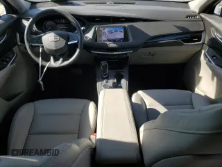 2022 Cadillac XT4 FWD Premium Luxury with VIN 1GYFZCR43NF154997, listed as a Copart auction lot 81942214 with 22,697 mi miles and Salvage title. Bid and sale history available at DreamBid. Image 8.