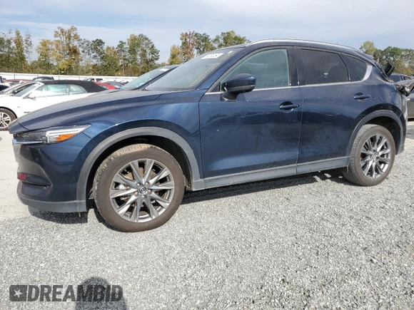2021 Mazda CX-5 Signature with VIN JM3KFBEY3M0439658, listed as a Copart auction lot 74534464 with 50,816 mi miles and Salvage Title. Bid and sale history available at carsss.com. Image 1.