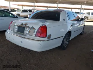 2002 Lincoln Town Car Sig. with VIN 1LNHM82W02Y626302, listed as a IAAI auction lot 41988496 with 193,346 mi miles. Bid and sale history available at carsss.com. Image 4.