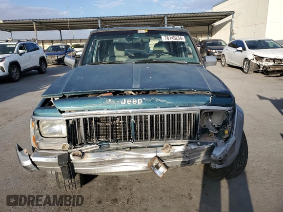 1995 Jeep Cherokee Country with VIN 1J4FJ78S5SL636284, listed as a Copart auction lot 76145234 with 104,048 mi miles and Salvage Title. Bid and sale history available at carsss.com. Image 5.