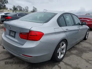 2014 BMW 3 Series 328i with VIN WBA3C1C53EK109613, listed as a IAAI auction lot 41713060 with 141,240 mi miles. Bid and sale history available at carsss.com. Image 4.