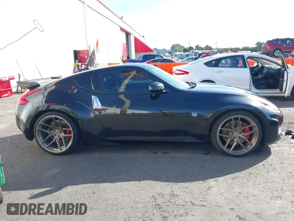 2013 Nissan 370Z z VIN JN1AZ4EH1DM880739, wystawiony jako IAAI lot #40474120 z przebiegiem 76 369 mil mil oraz . Historia ofert i sprzedaży dostępna na DreamBid. Obrazek 13.
