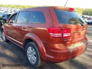 2014 Dodge Journey SE with VIN 3C4PDCAB9ET245801, listed as a IAAI auction lot 41982250 with 119,468 mi miles. Bid and sale history available at carsss.com. Image 3.