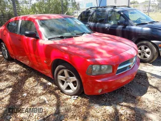 2009 Dodge Charger SXT with VIN 2B3KA33V49H556093, listed as a IAAI auction lot 42048956 with 164,284 mi miles. Bid and sale history available at carsss.com. Image 1.