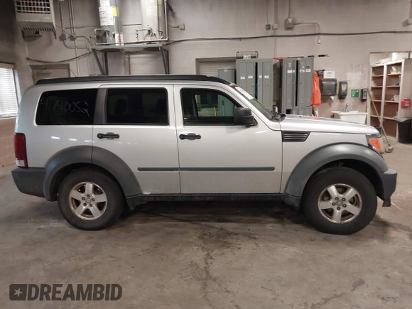 2007 Dodge Nitro SXT with VIN 1D8GU28K47W569317, listed as a IAAI auction lot 41740052 with 220,265 mi miles. Bid and sale history available at carsss.com. Image 13.