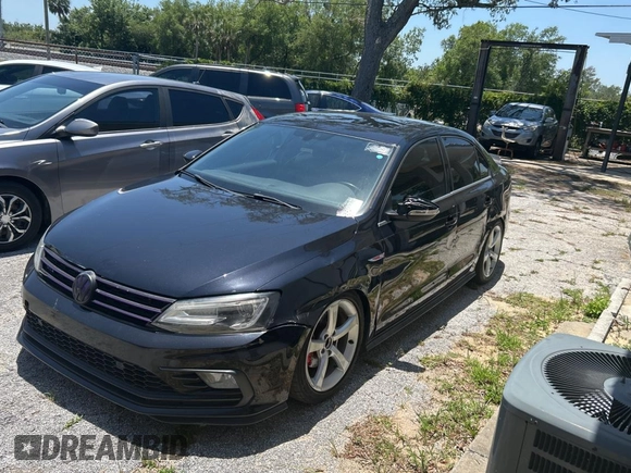 2017 Volkswagen Jetta GLI z VIN 3VW5T7AJ9HM330125, wystawiony jako Copart lot #57632155 z przebiegiem 103 949 mil mil oraz Czysty tytuł • Clean title. Historia ofert i sprzedaży dostępna na DreamBid. Obrazek 2.