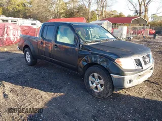 2009 Nissan Frontier LE with VIN 1N6AD09UX9C404043, listed as a IAAI auction lot 41476388 with 198,612 mi miles and . Bid and sale history available at DreamBid. Image 1.