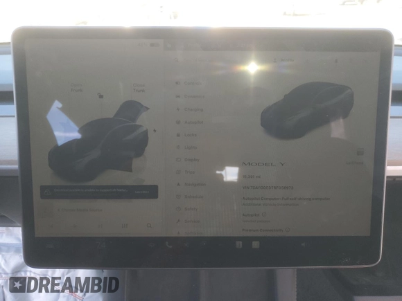 2024 Tesla Model Y with VIN 7SAYGDED7RF056973, listed as a Copart auction lot 87139214 with 15,391 mi miles and Salvage Title. Bid and sale history available at DreamBid. Image 9.