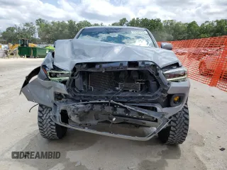 2020 Toyota Tacoma SR5 z VIN 3TMAZ5CN0LM115004, wystawiony jako Copart lot #55343295 z przebiegiem 82 865 mil mil oraz Nie do naprawy • Non repairable. Historia ofert i sprzedaży dostępna na DreamBid. Obrazek 5.