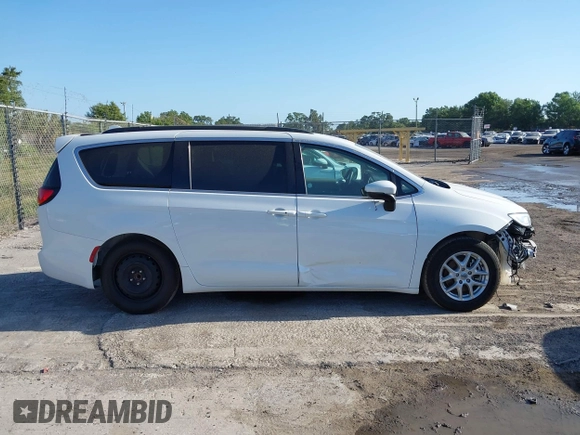 2022 Chrysler Pacifica Touring L with VIN 2C4RC1BGXNR233654, listed as a IAAI auction lot 42137632 with 73,899 mi miles and . Bid and sale history available at DreamBid. Image 14.