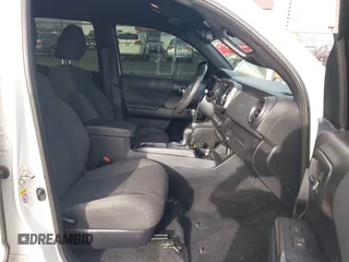 2019 Toyota Tacoma SR z VIN 3TMCZ5AN9KM284092, wystawiony jako IAAI lot #41774851 z przebiegiem 100 031 mil mil oraz . Historia ofert i sprzedaży dostępna na DreamBid. Obrazek 5.
