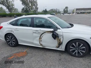 2024 Honda Civic EX z VIN 2HGFE1F77RH337748, wystawiony jako IAAI lot #42047010 z przebiegiem 5 598 mil mil oraz . Historia ofert i sprzedaży dostępna na DreamBid. Obrazek 6.