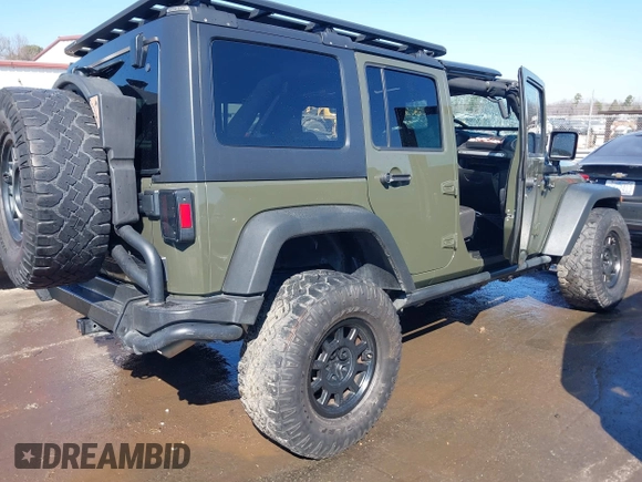 2015 Jeep Wrangler Unlimited Rubicon with VIN 1C4BJWFG0FL623431, listed as a IAAI auction lot 41651317 with 105,508 mi miles. Bid and sale history available at carsss.com. Image 4.
