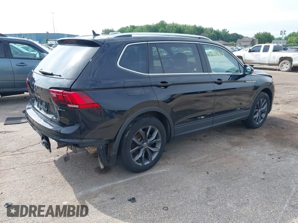 2023 Volkswagen Tiguan SE with VIN 3VVMB7AXXPM003447, listed as a IAAI auction lot 42566061 with 39,185 mi miles and . Bid and sale history available at DreamBid. Image 4.
